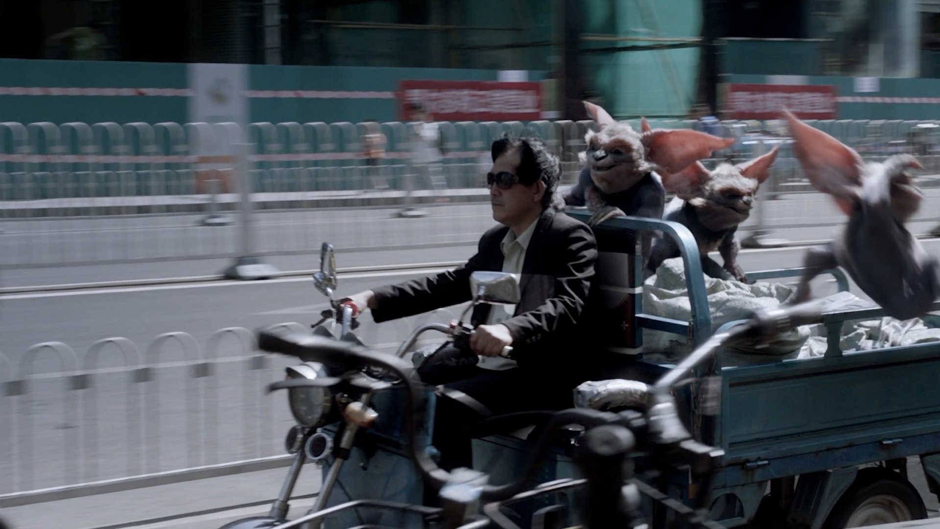 A driver without a helmet.